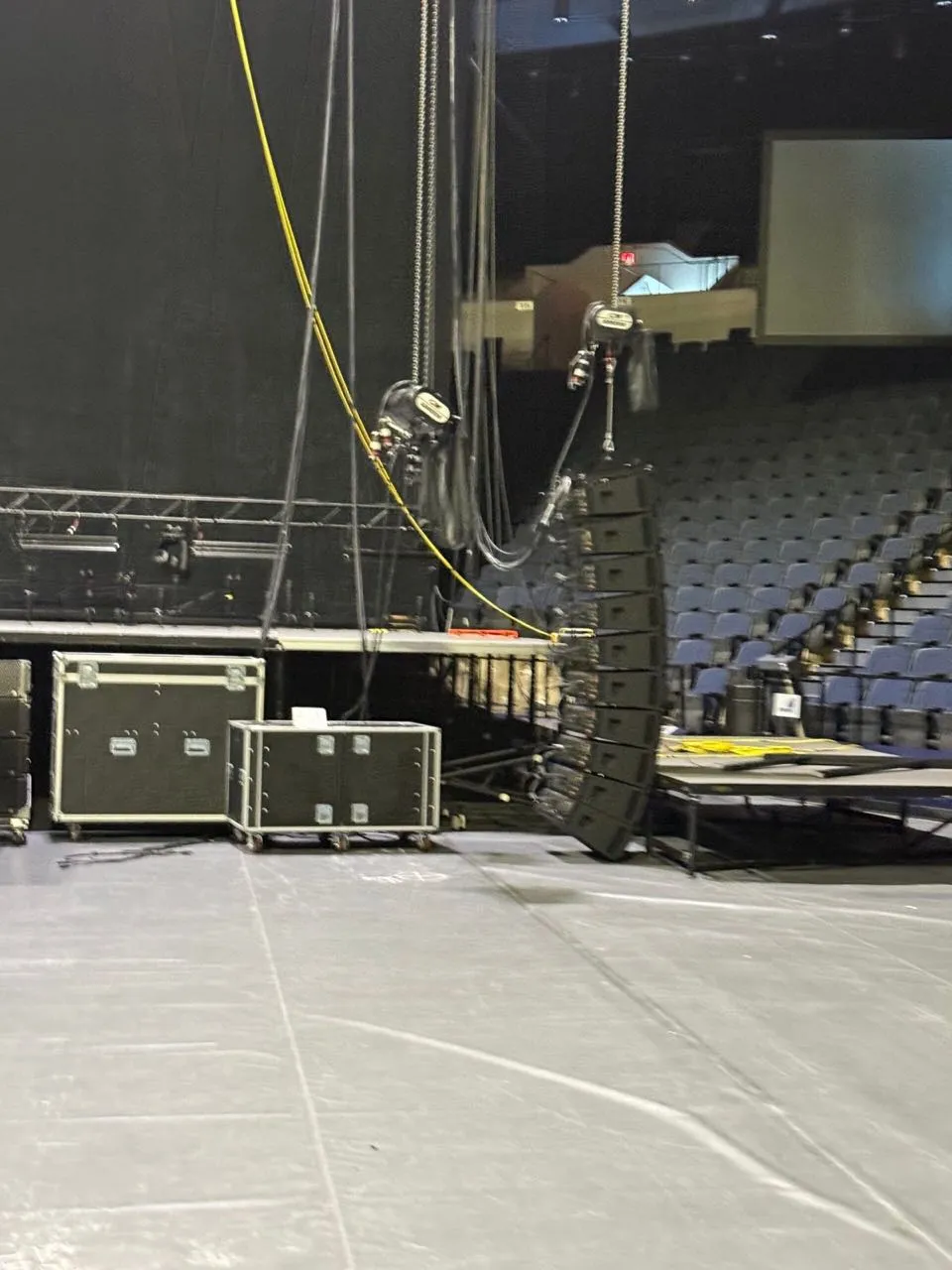 Line array flown on chain hoists during a Phase 3 Live arena production setup
