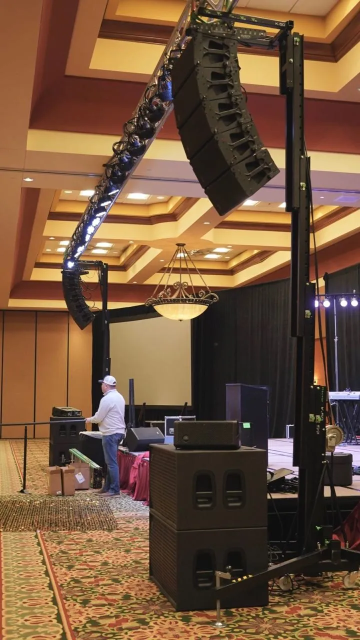 Phase 3 Live line array and lighting truss rigged on lift towers for a ballroom corporate event