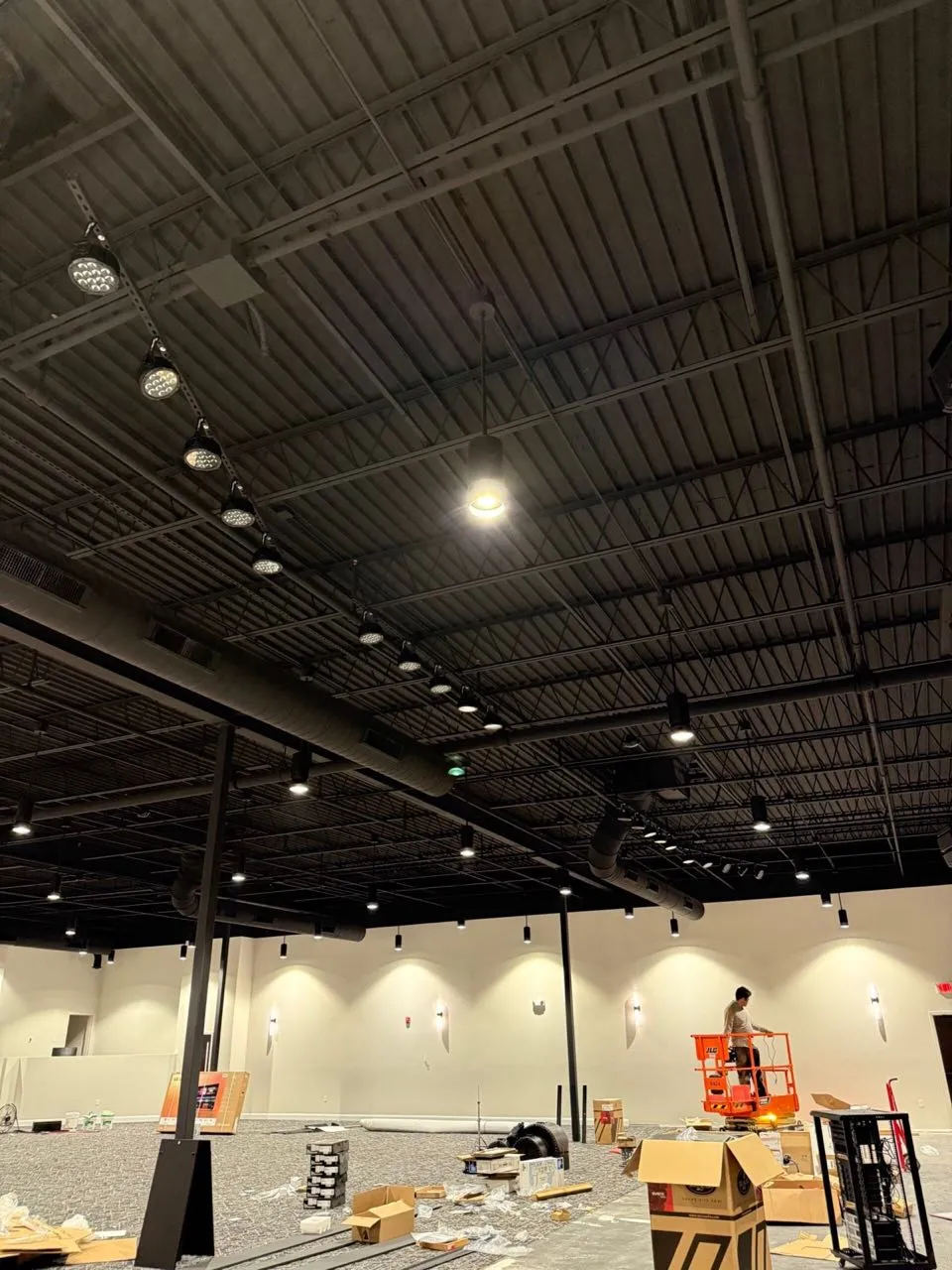 Ceiling-rigged LED stage lighting installed by Phase 3 Live in a large event venue.