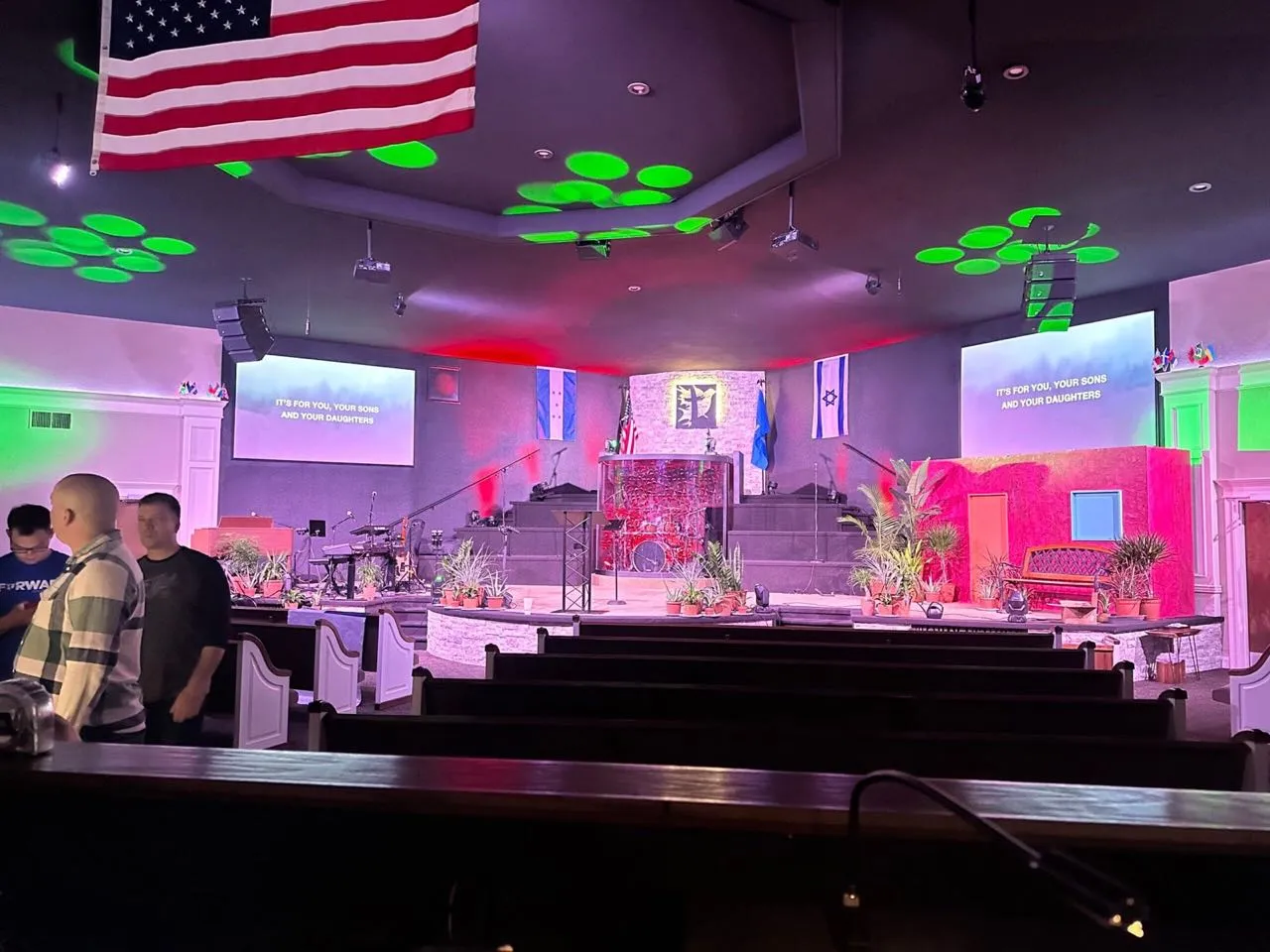 Colorful stage lighting and lyric projection in a church sanctuary produced by Phase 3 Live.