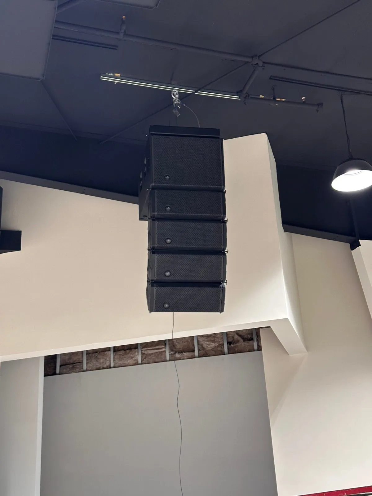 Flown line array speaker cluster rigged from the ceiling during a Phase 3 Live audio installation