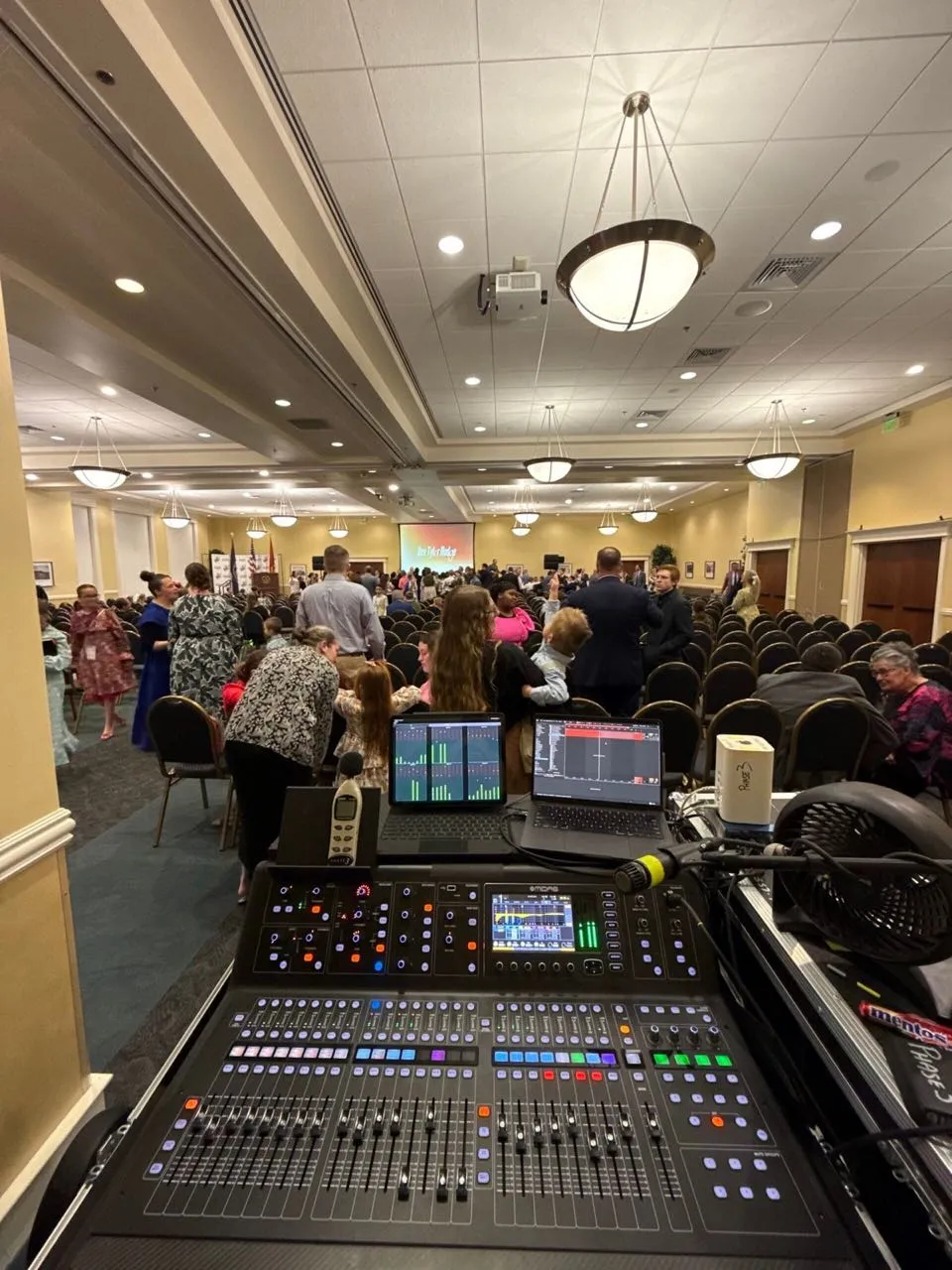 Front-of-house mixing console run by Phase 3 Live in a chandelier-lit ballroom