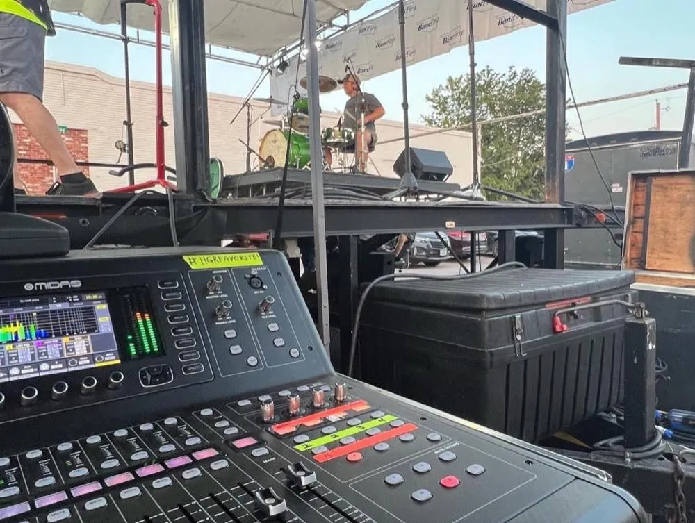 Front-of-house Midas mixing console run by Phase 3 Live at an outdoor concert