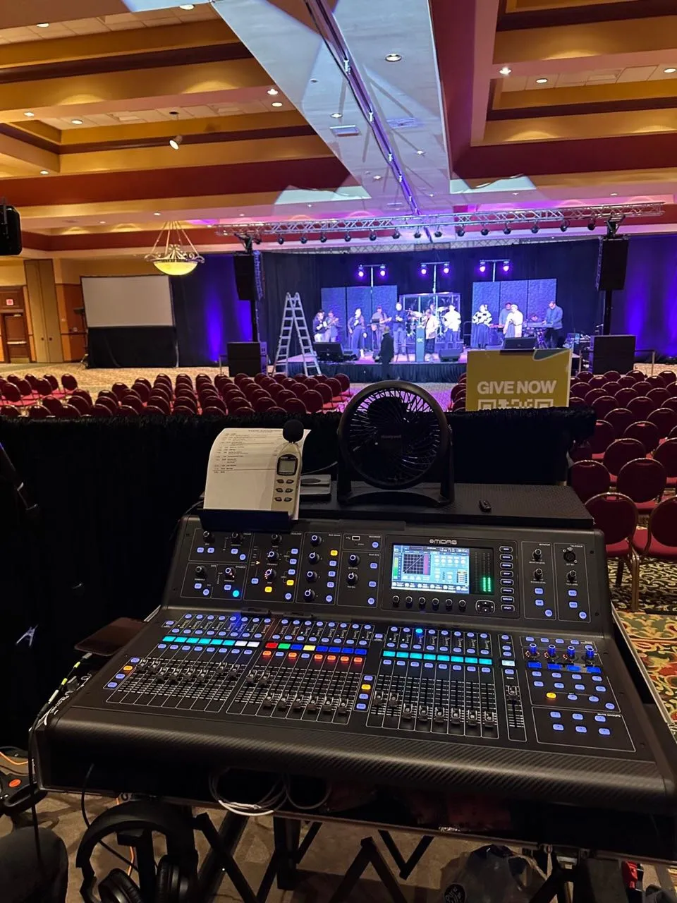Phase 3 Live front-of-house console facing a worship band on a ballroom stage