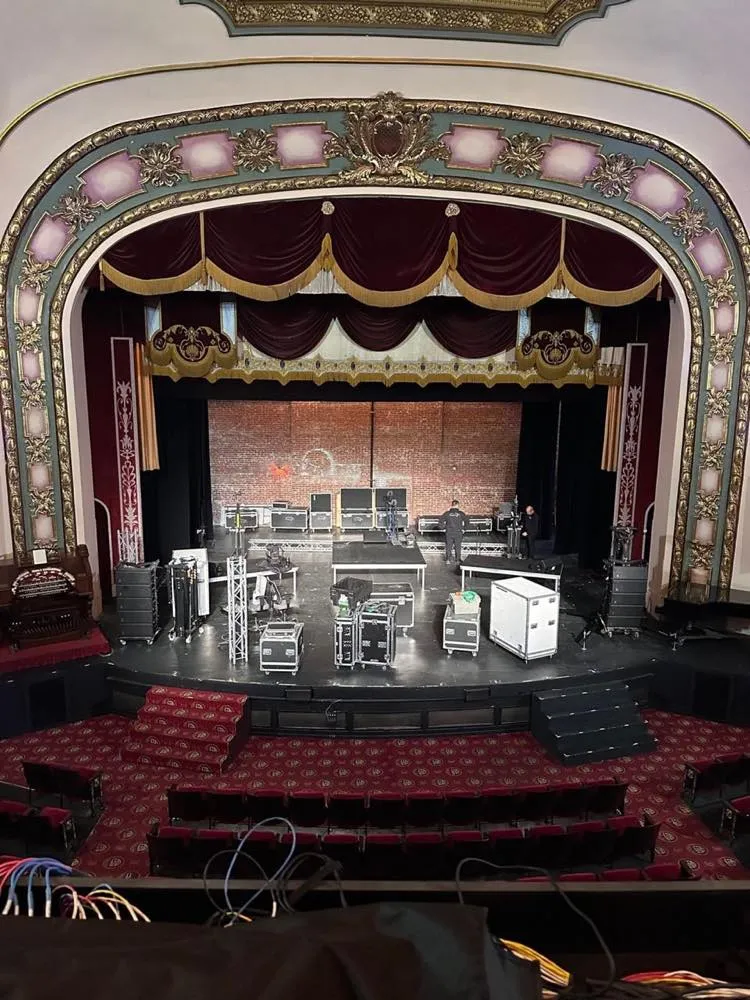 Historic gilded theater proscenium during a Phase 3 Live concert load-in