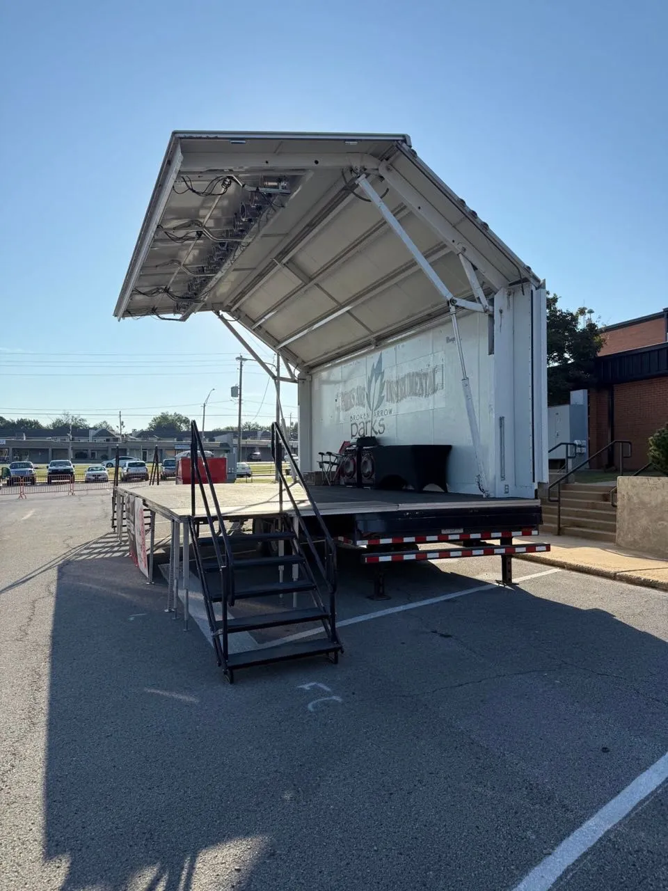 Hydraulic mobile stage set up for a Broken Arrow Parks concert event.