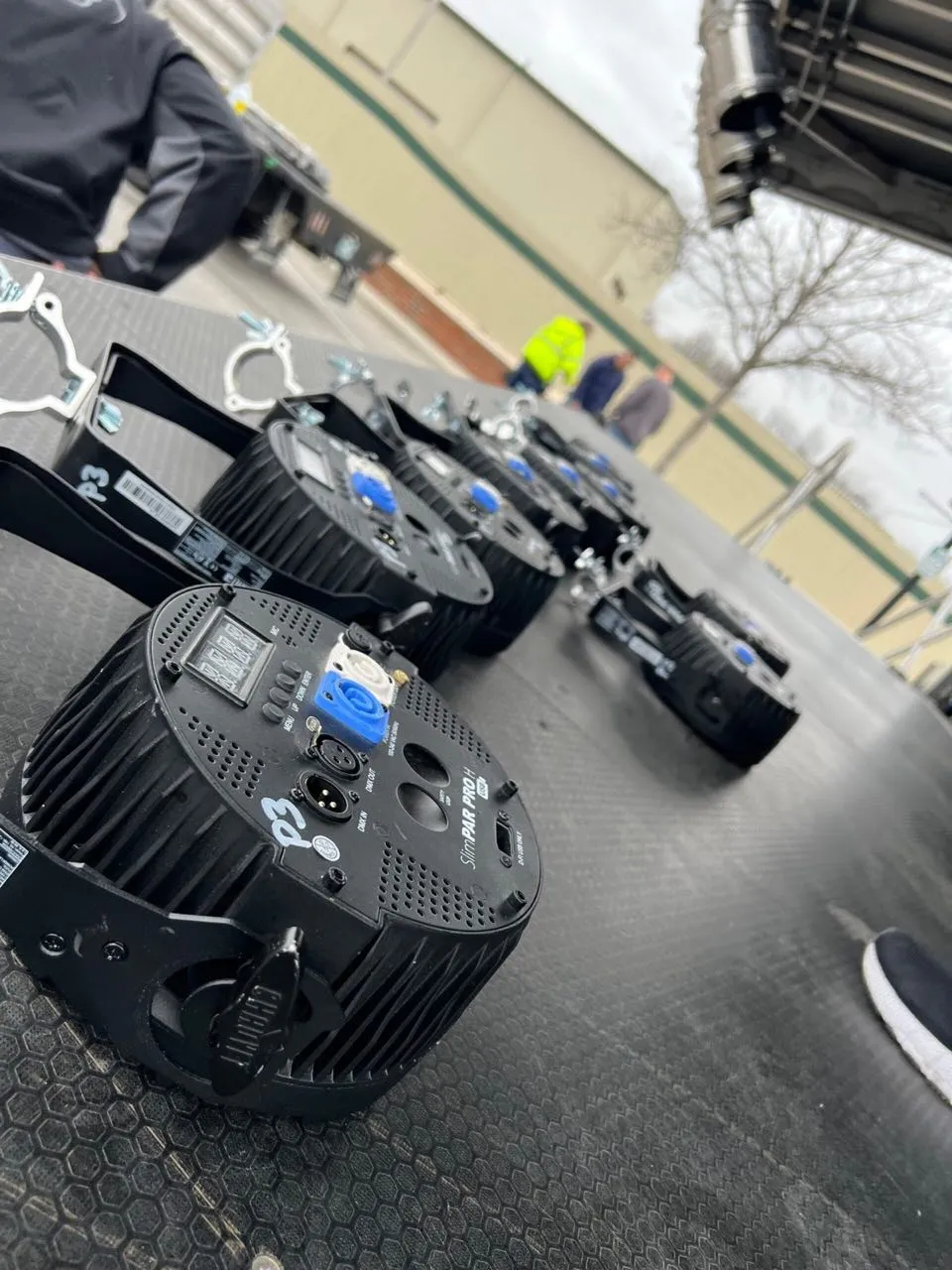 LED par stage lighting fixtures staged by Phase 3 Live during load-in for an outdoor event