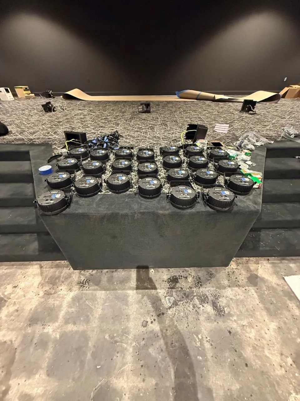 Rows of LED par stage lights staged by Phase 3 Live ahead of a venue lighting installation.