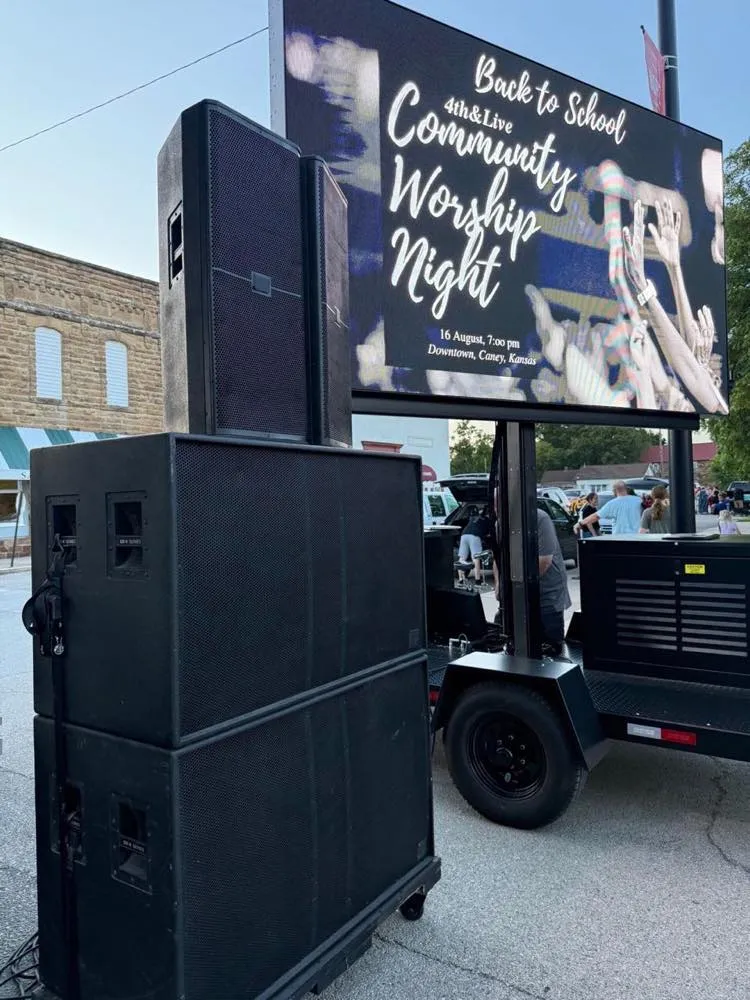 Mobile LED video wall trailer and PA speakers deployed by Phase 3 Live for a community worship night in Caney, Kansas.