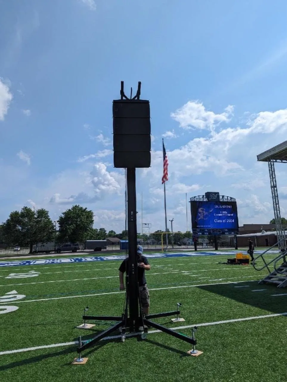 Phase 3 Live line-array speakers on a lift tower for an outdoor stadium graduation ceremony