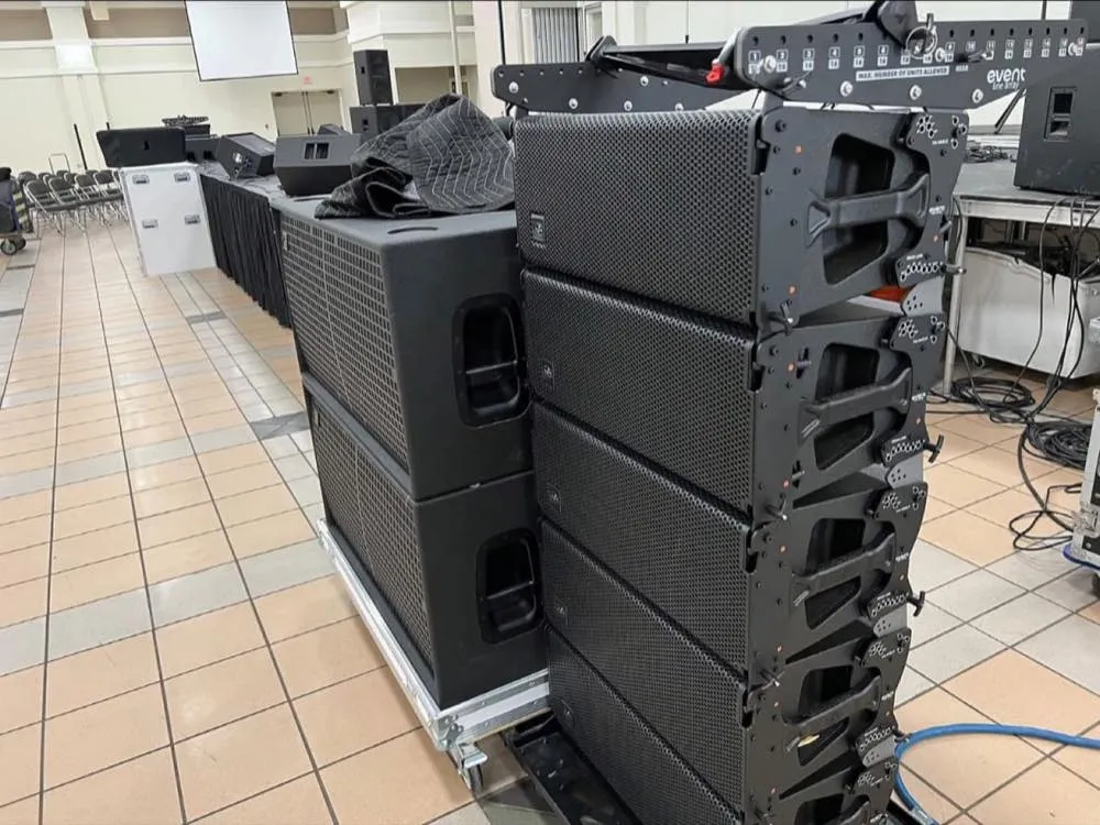 Line array speakers and subwoofers staged by Phase 3 Live during a venue load-in