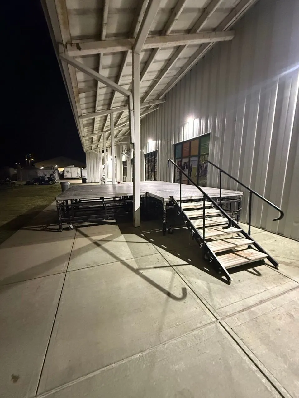 Modular staging with stair unit from Phase 3 Live's rental inventory set up for an outdoor event
