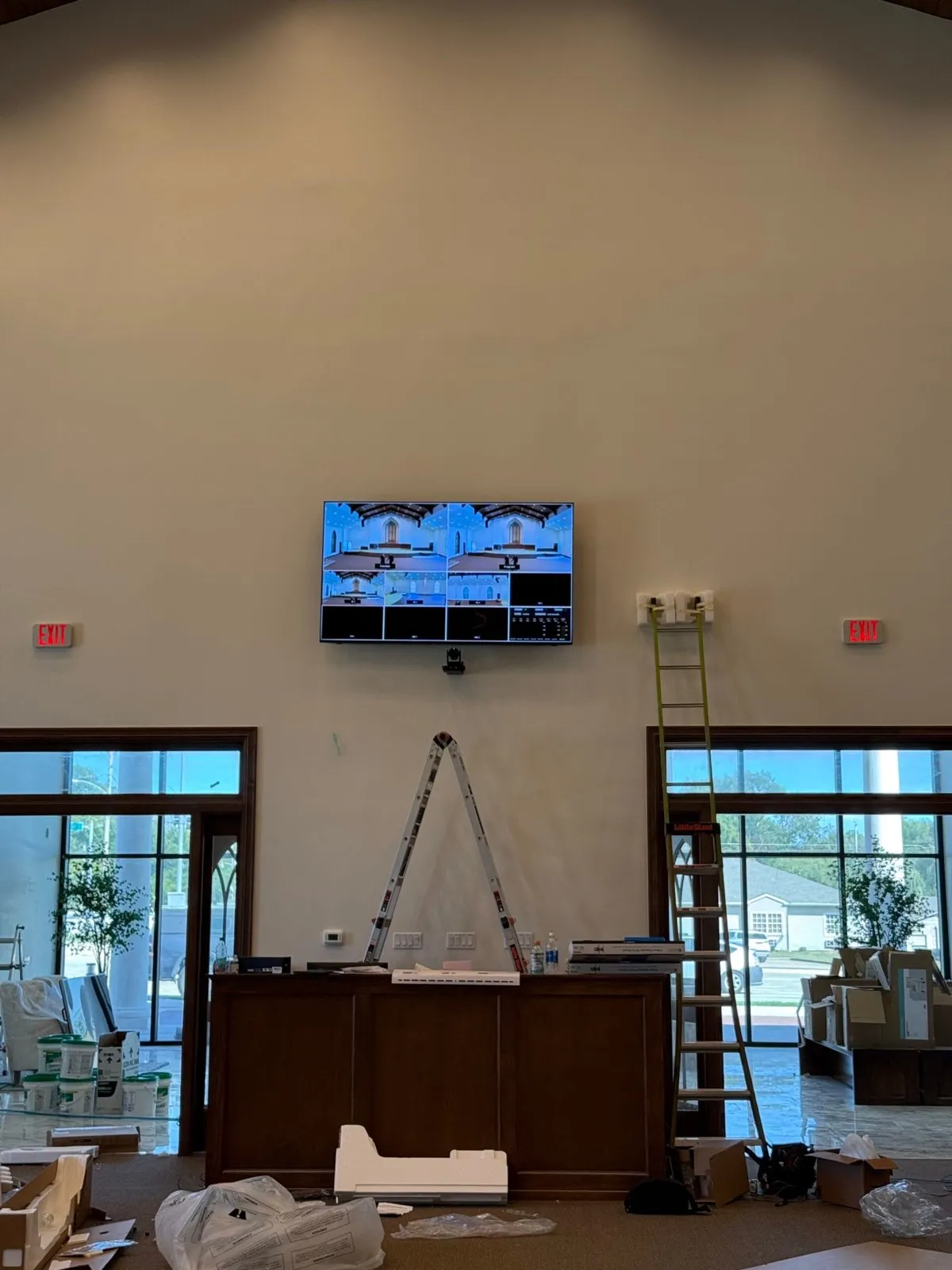 Multiview production monitor and PTZ camera installed by Phase 3 Live on the back wall of a church.