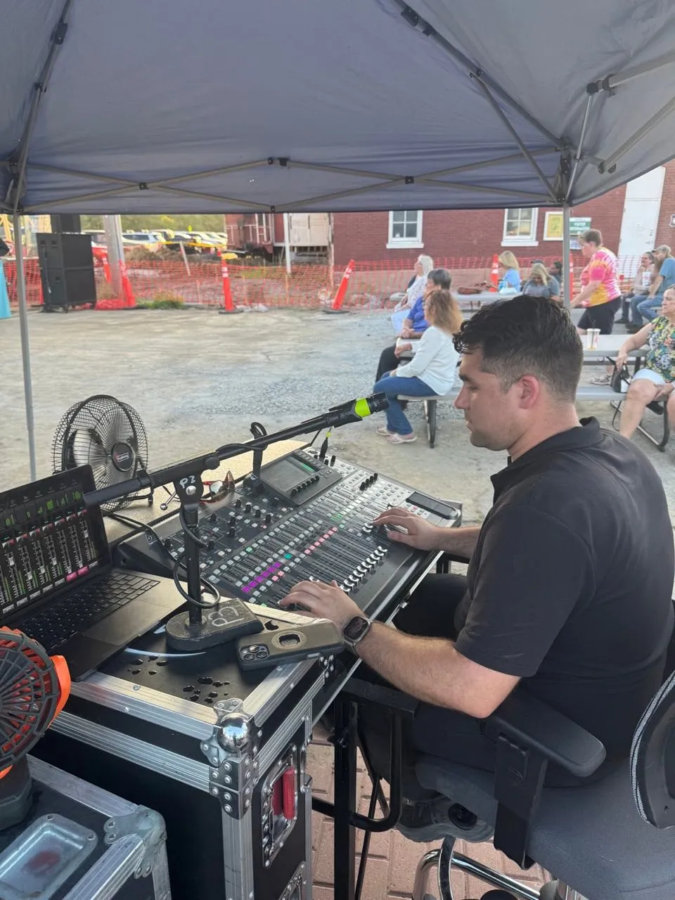 Phase 3 Live engineer mixing front of house at an outdoor community event