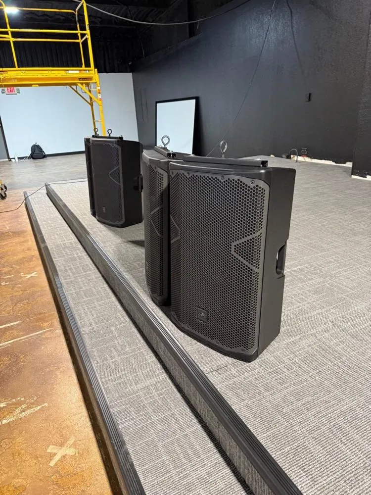 PA loudspeakers with rigging hardware staged for installation by Phase 3 Live
