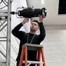 Jacob Avendano working on a lighting rig for Phase 3 Live
