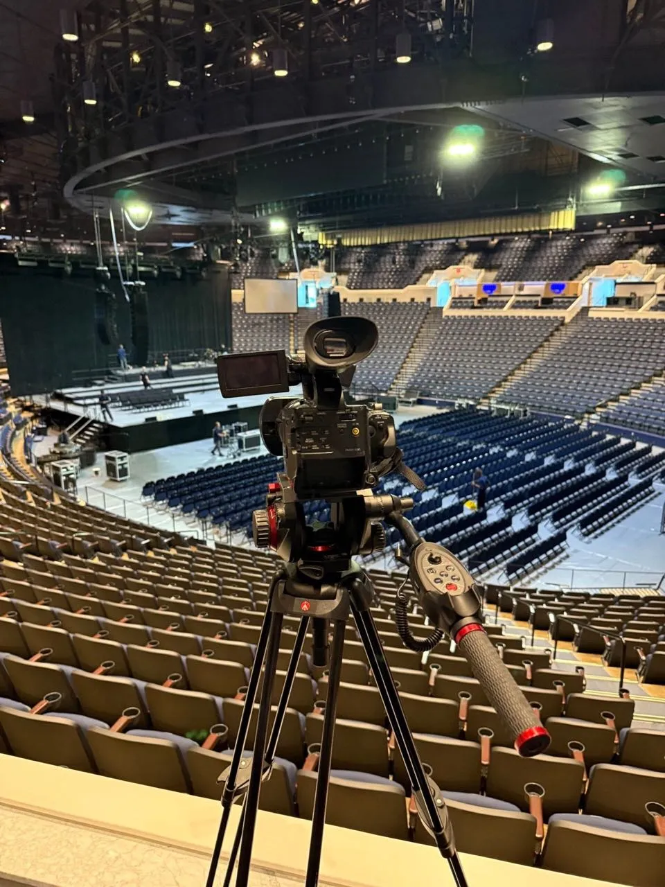 Video camera positioned over an empty arena ahead of a Phase 3 Live event production