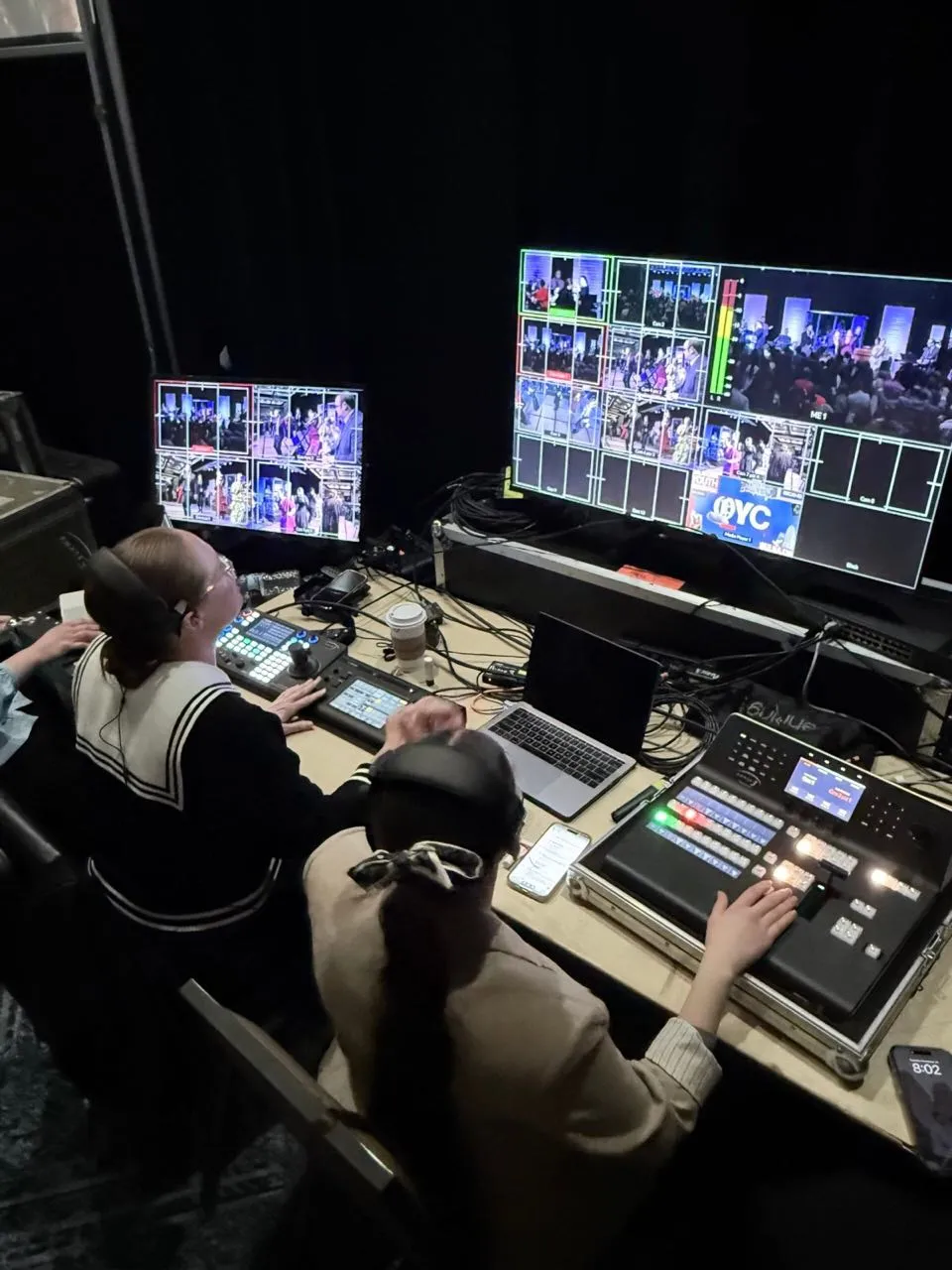 Phase 3 Live video crew operating a multi-camera switcher and multiview monitors at a live event broadcast station