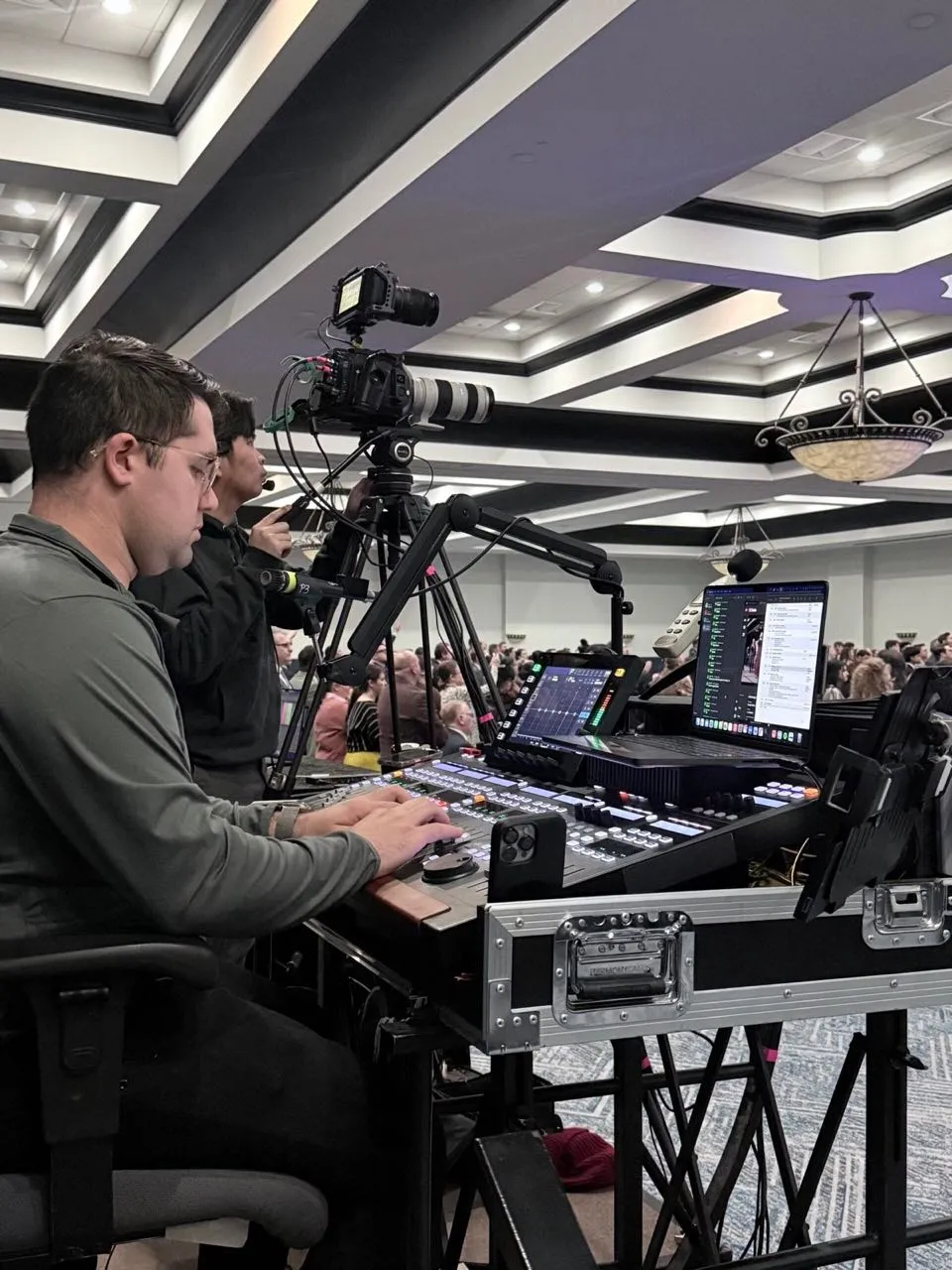 Phase 3 Live video director at a switcher console during a live ballroom event